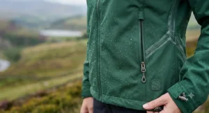 Side view showing the zipped security pocket on a ladies hiking jacket.