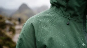 Close-up of the breathable, seam-sealed fabric technology on a women's waterproof jacket.