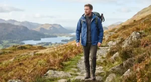 A hiker wearing a breathable mens 3 in 1 jacket while walking in the Lake District.