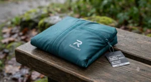 Lightweight and packable womens running rain jacket folded neatly for wet weather training sessions