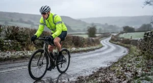 Cyclist wearing a high-visibility water-resistant softshell jacket for winter road cycling