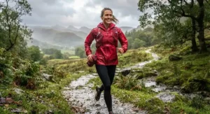 Woman in a lightweight, packable running rain jacket ready for unpredictable British weather