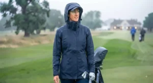 A functional ladies' golf rain jacket with a protective hood, perfect for playing in British downpours.
