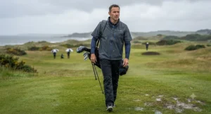 Water-repellent short sleeve golf rain jacket worn over a polo shirt