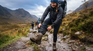 Illustration demonstrating quick boot removal when wearing festival vs hiking overtrousers